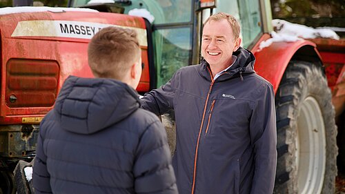 Tim listening to a local farmer