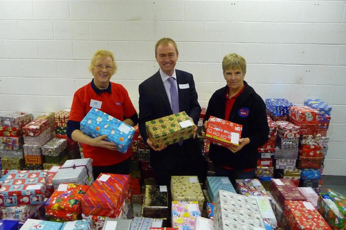 Tim checking the shoeboxes with volunteers. From left to right Mrs Patricia Robin (Polly), Tim, and Mrs Rosemary Webster.     