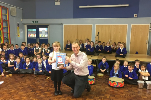 Tim with this year's winner of the Christmas card competition