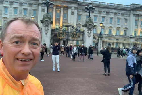 Tim running outside Buckingham Palace