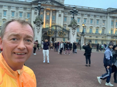 Tim running outside Buckingham Palace