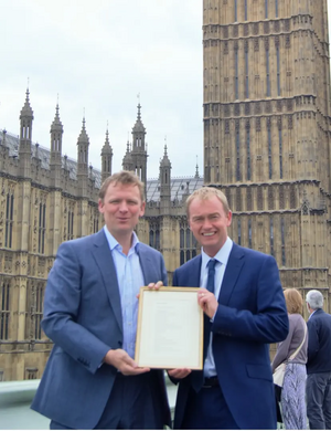 William Wordsworth’s great-great-great-great-grandson Christopher Wordsworth presenting Tim with a framed copy of this year’s winning poem by Jacob Currie.