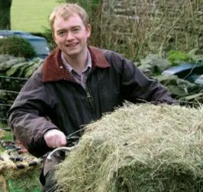 Tim on a quad bike on a hill farm