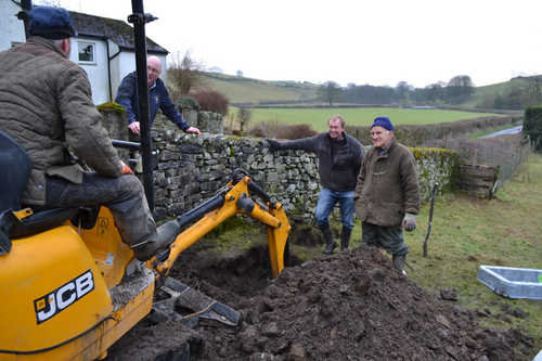 Tim Farron with digger and wall B4RN