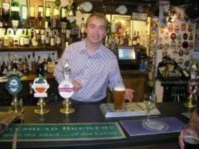 Tim pulling pints in the Sun Inn, Coniston