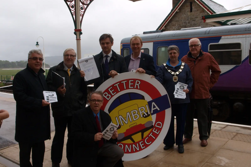 From left to right, Ian Stephens (Cumbria Tourism, Chief Executive), Cllr Peter Thornton (Leader, SLDC), John Woodcock MP, Tim Farron MP, Cllr Liz Lewis (Mayor of Grange) & at the front Cllr Frank Cassidy (Barrow councillor)    