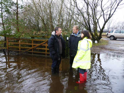 Tim with local residents near Levens after Storm Desmond in 2015