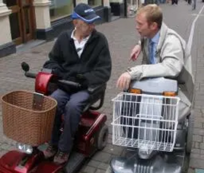 Tim Farron MP on a fact-finding mission with a wheelchair user