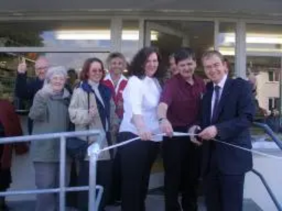 Tim is photographed with Bill Riddell the new owner of Oxenholme Post Office and Stores cutting the ribbon to open the store.