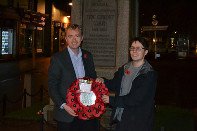 Tim laying a wreath