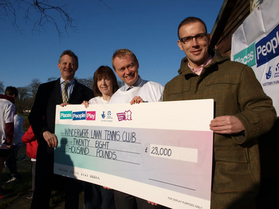 Tim joins county councillor Jo Stephenson to welcome the grant for Windermere tennis club from Sport England