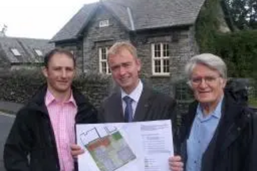 Tim Farron and Cllr Colin Davies view plans for new affordable housing in Hawkshead