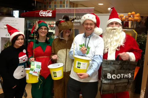 South Lakes MP Tim Farron joined volunteers to bag pack at Booths in Windermere this morning to raise funds for St John’s Hospice.