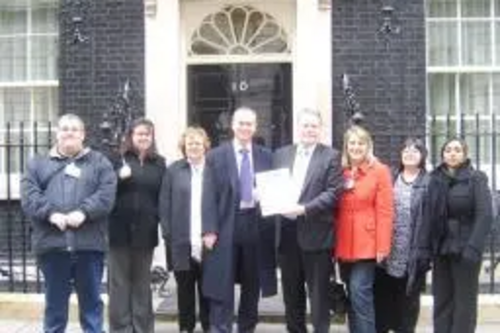 From left to right. Darren Osbourne, Cheryl Hudson, Wendy Ferrell, Tim Farron MP, David Borrow MP, Christine Steel, Debbie Osbourne, Dennisha Villaverde