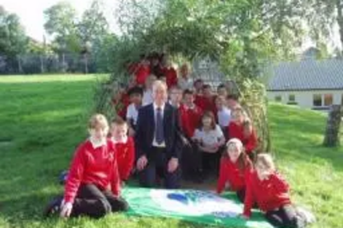 Tim with pupils from Grange Primary School and their 'green flag'