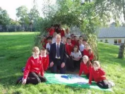 Tim with pupils from Grange Primary School and their 'green flag'