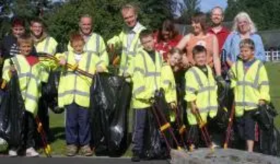 Tim Farron and residents litterpick on the Kirkbarrow Estate in Kendal