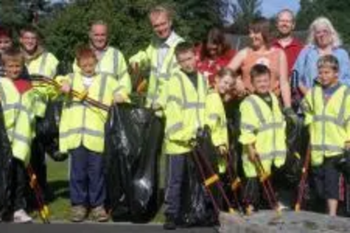 Tim Farron and residents litterpick on the Kirkbarrow Estate in Kendal